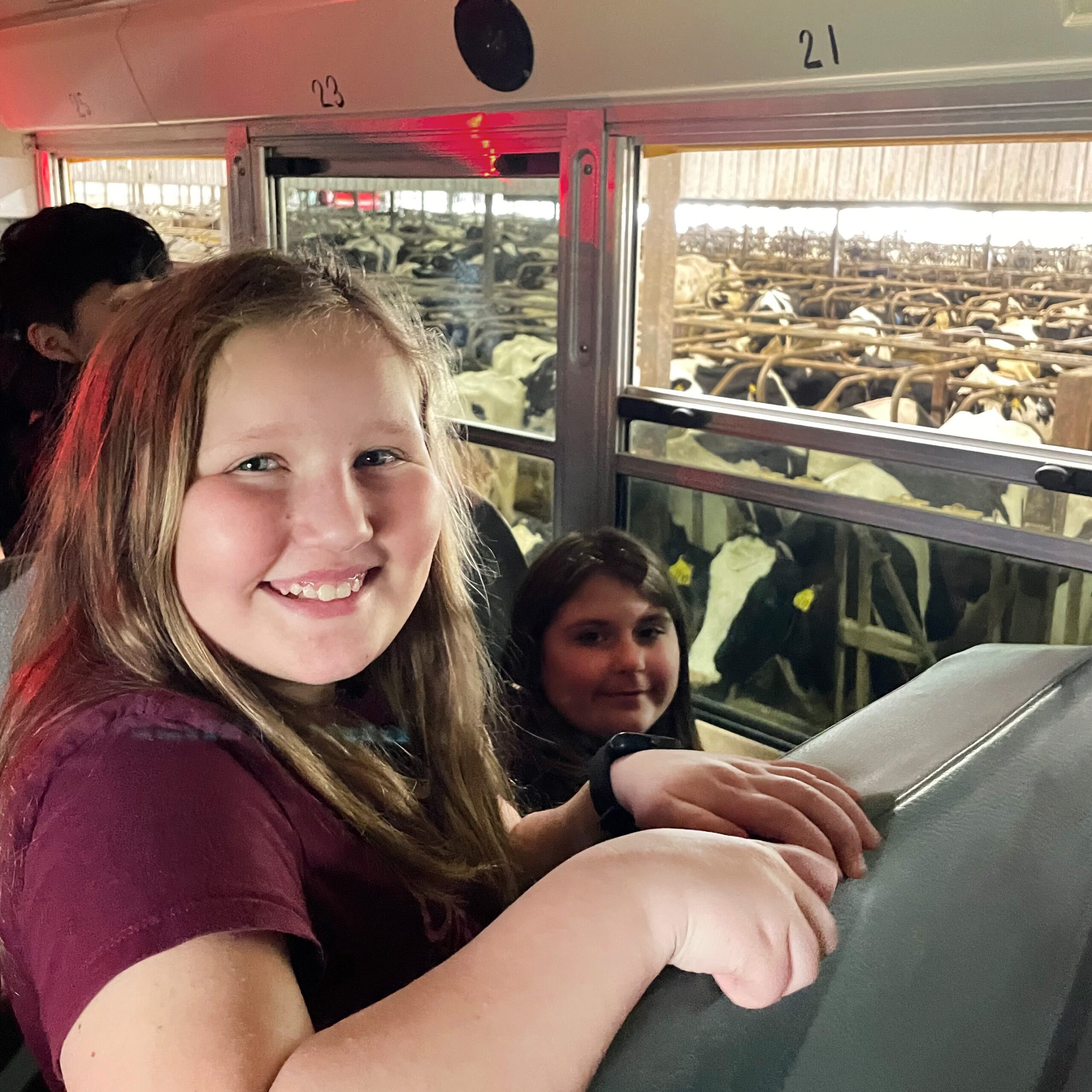 Student smiling on the dairy farm bus tour